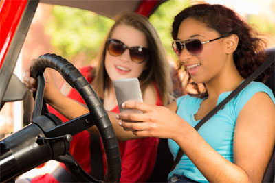 Girls on the phone while driving