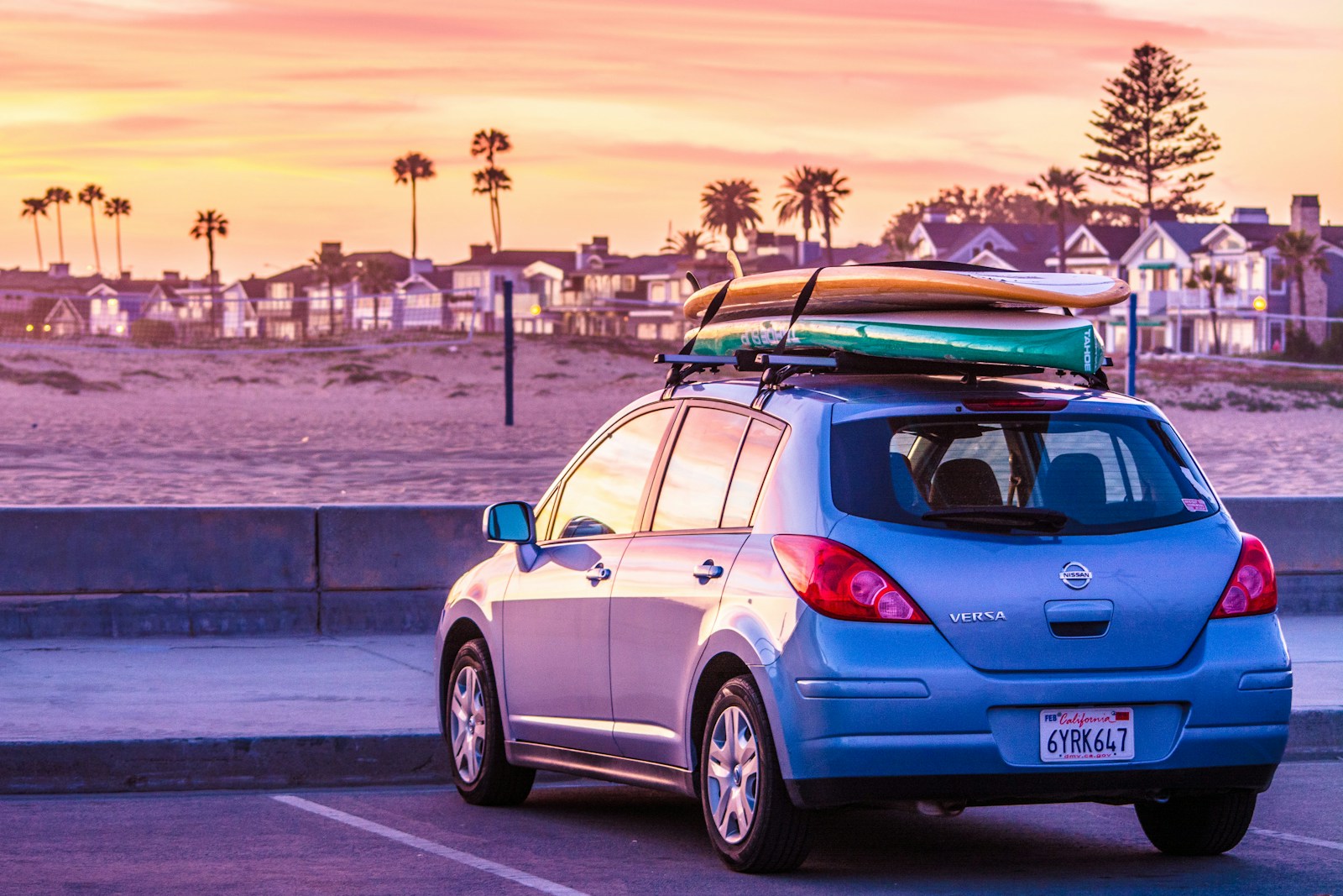 a car with a surfboard on top of it